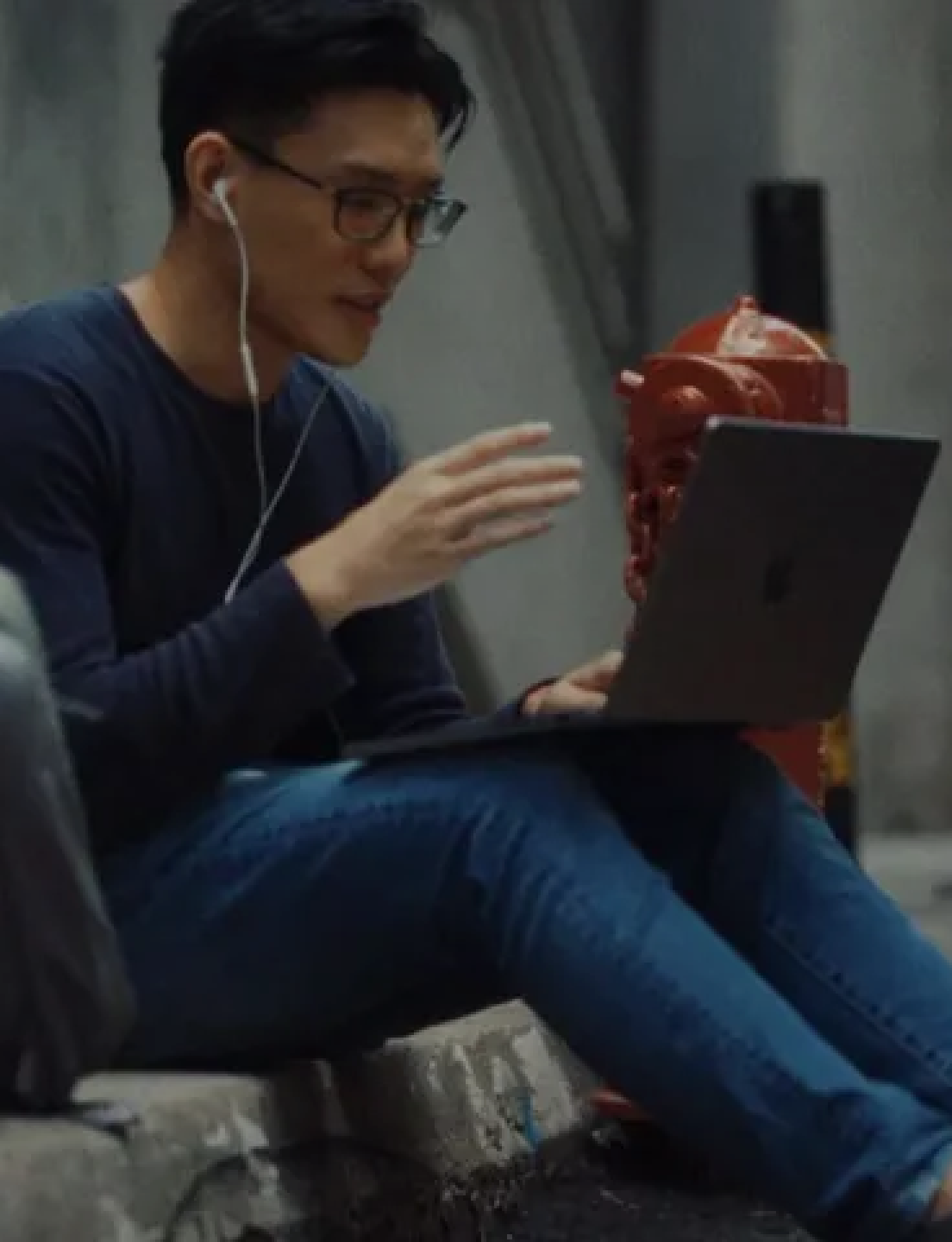 A man talking with someone on his laptop